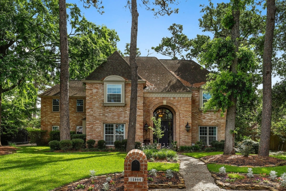 Two-story brick home with storm insurance in case a storm damages the home 
