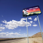 welcome to nevada sign with desert and sky_getty
