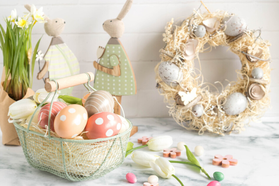 Easter decorations with bunnies and Easter eggs sit on a marble countertop